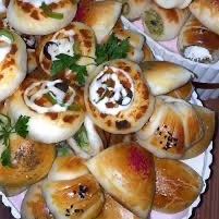 معجنات مشكله وسمبوسه  وبيتزا وأقماع